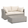 Salon de jardin 2 places avec table basse en résine tressée grise et coussins beige 150 x 85 x 85 cm